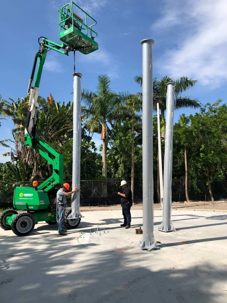 Tall gray columns for outside installation of a pendulum