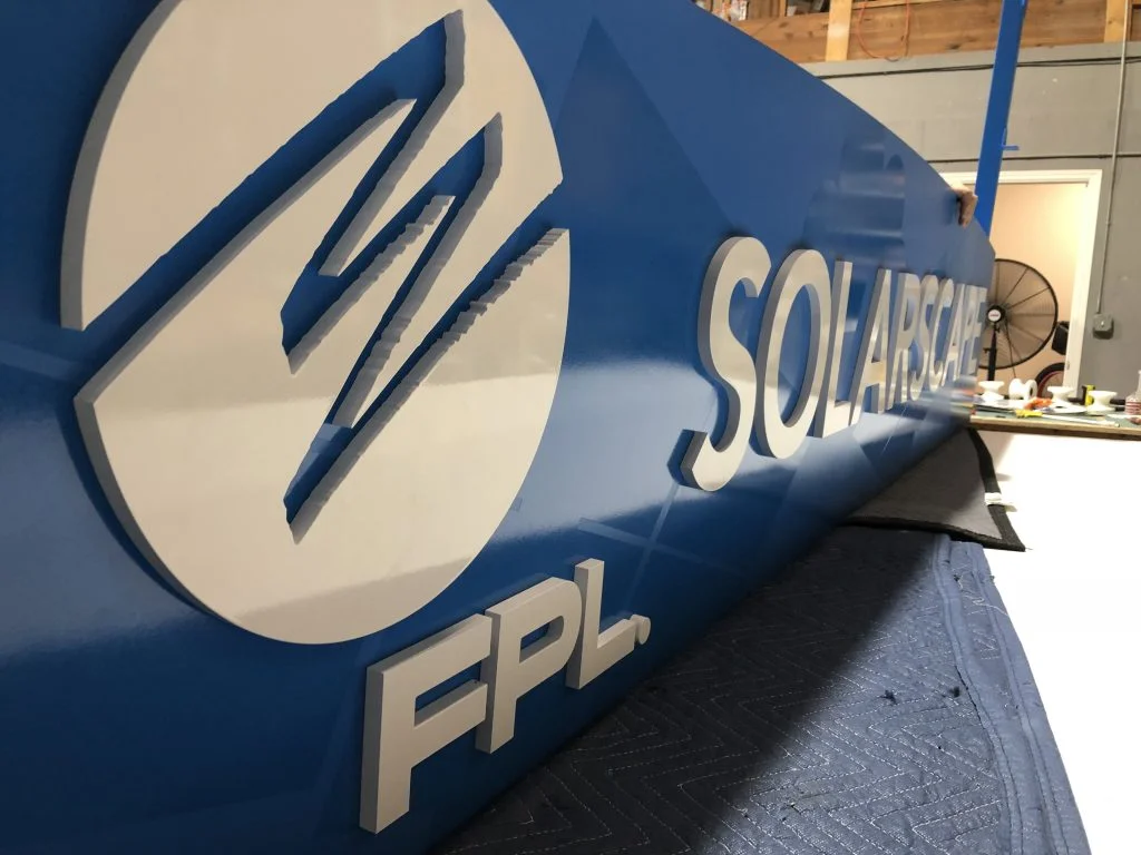 3-dimensional dark blue sign of a company logo named FPL, created by VSP digital Marketing, South Florida