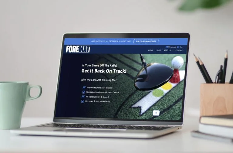 Laptop with a golf website displayed on the screen.